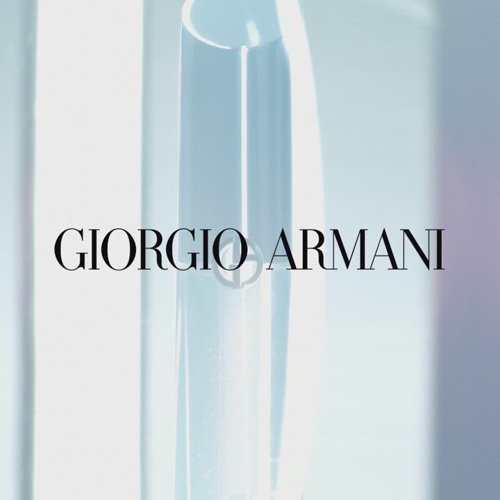 Close-up of a sleek, modern product with a transparent design, featuring the text "Giorgio Armani" prominently displayed.