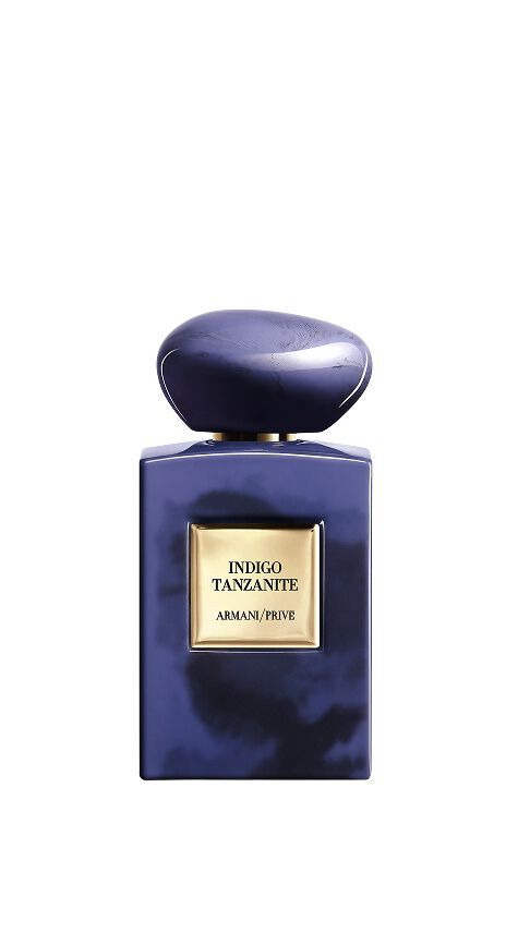 Armani/Prive Indigo Tanzanite: a marbled indigo blue bottle capturing the mysterious glow of the African night sky, celebrating the velvety depth of patchouli and the mineral power of the rare gemstone.