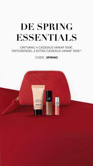 Armani Code Elixir fragrance bottle on a black leather background.