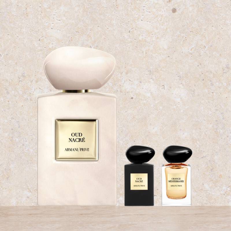 Trois flacons de parfum Armani/Prive : un grand Oud Nacre nacre et deux miniatures (Oud Nacre et Orange Mediterranee).
