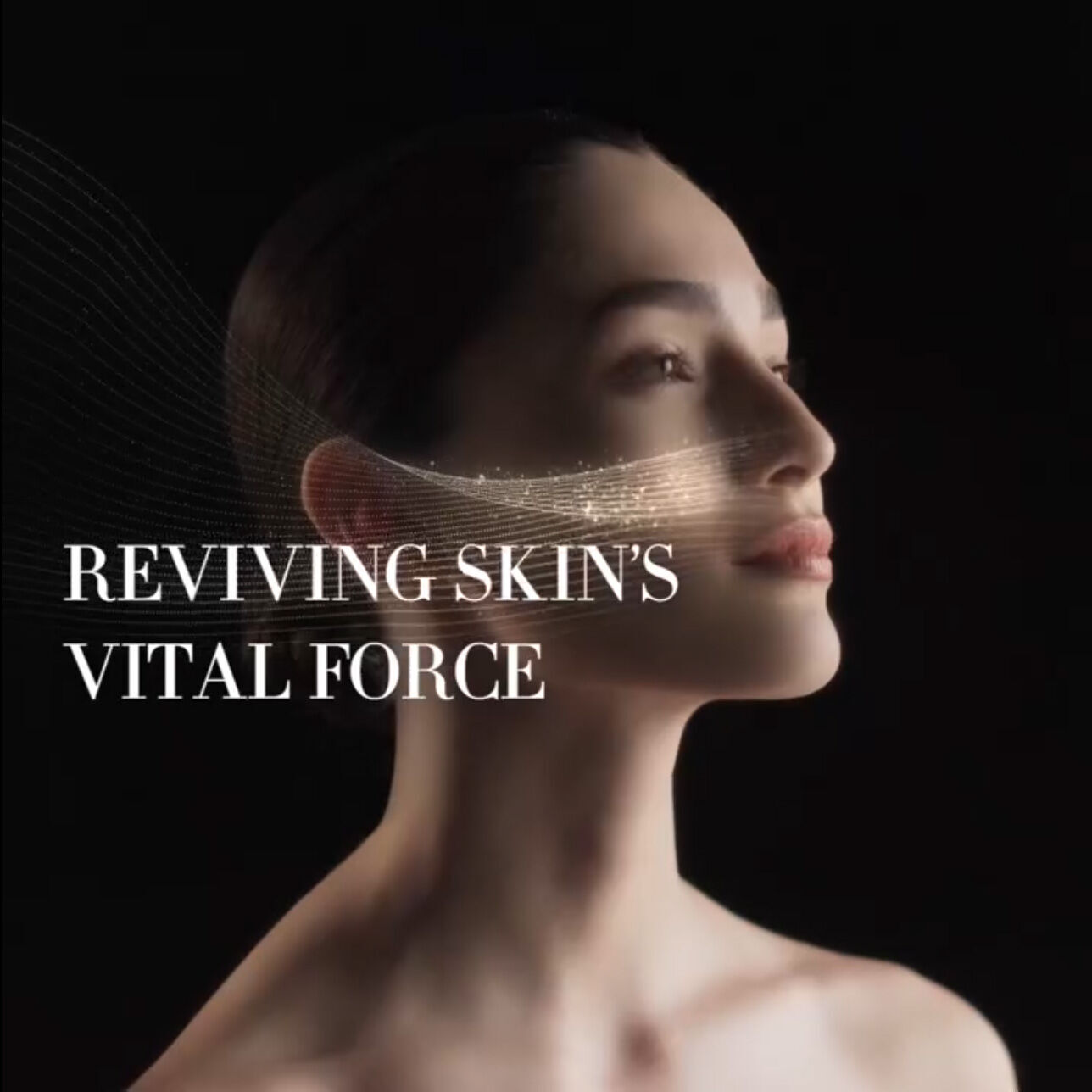 A serene profile of a woman with glowing skin, accompanied by the text "Reviving Skin’s Vital Force" in an elegant font against a dark background.