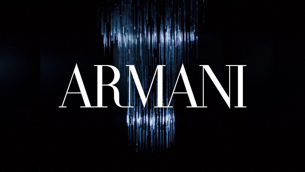 This video showcases Armani Beauty's holiday season collection. It features models at a party, showcasing various makeup products and fragrances. The overall atmosphere is festive and glamorous, with a focus on shimmering lights and elegant attire. The video highlights products such as lipstick, eyeshadow, and perfumes like "Si" and "Stronger With You."