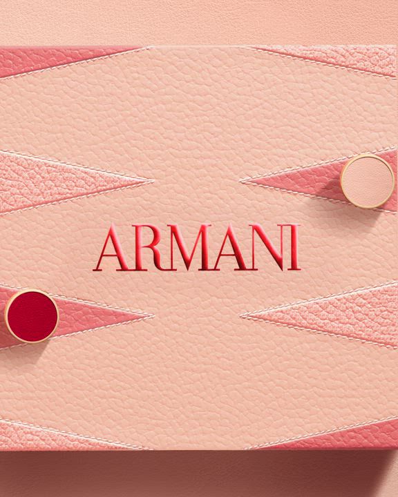 Luxury Armani Mother's Day gift set featuring a pink leather-textured box with backgammon geometric patterns. Inside, a Giorgio Armani "Si EDP" perfume bottle and travel size fragrance.
