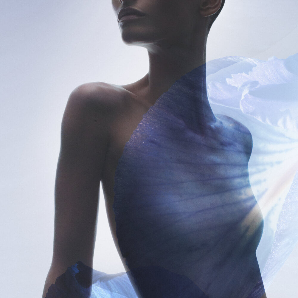 Female silhouette with blue floral overlay.