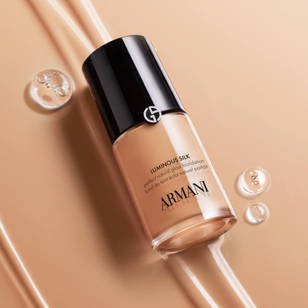 A close-up swirl of LUMINOUS SILK FOUNDATION shade, showcasing its weightless, silky texture and natural glow, indicative of its truer-to-skin formula.
