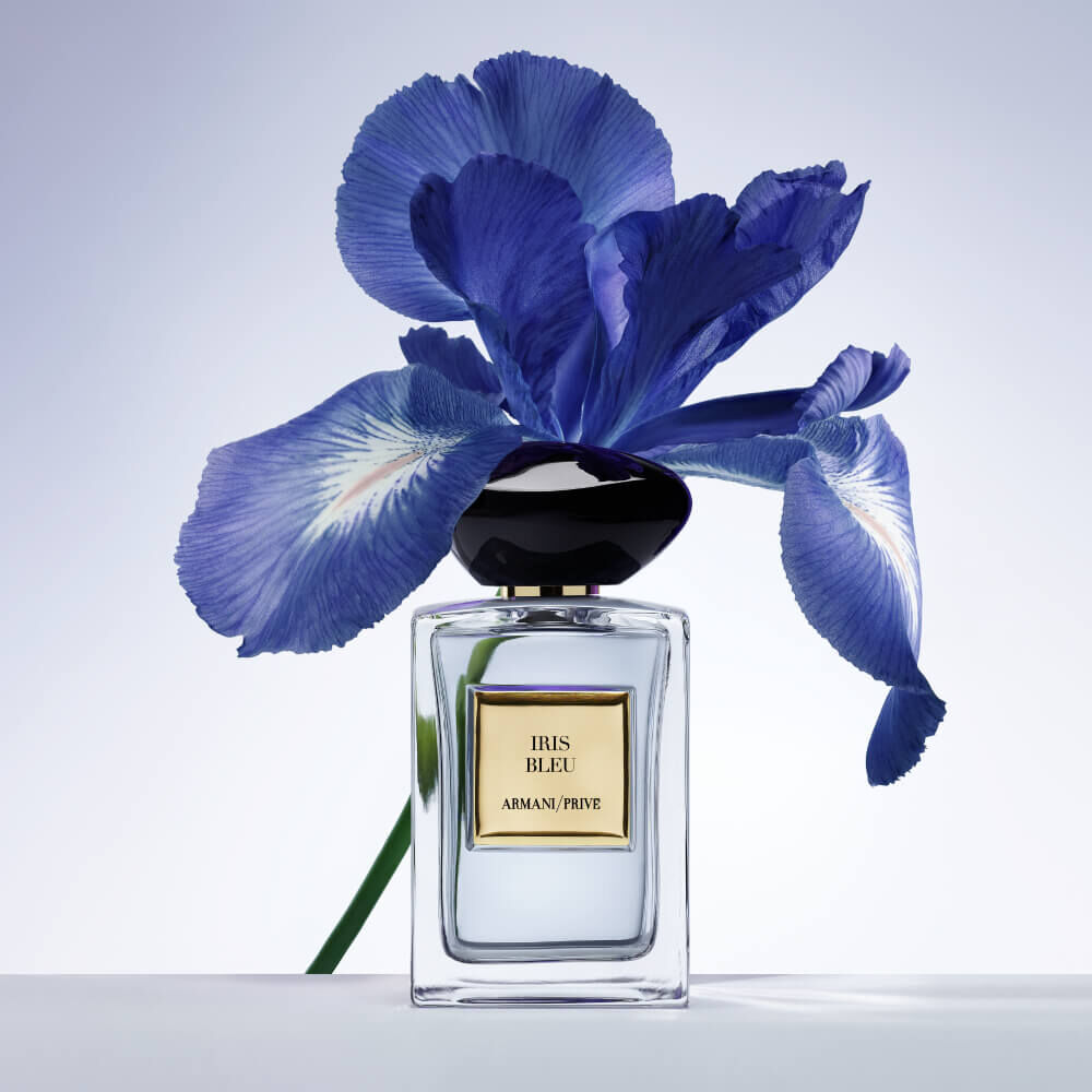 Perfume IRIS BLEU bottle with blue iris flower.